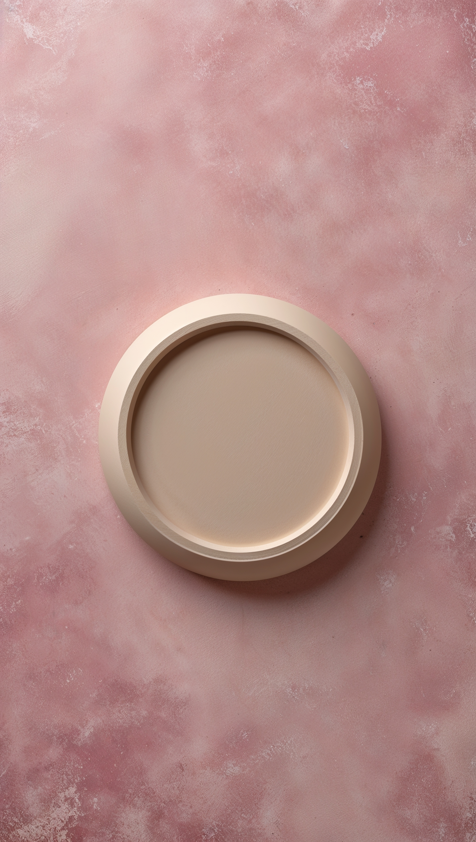 Soft pink background with one centered circle in cream tone