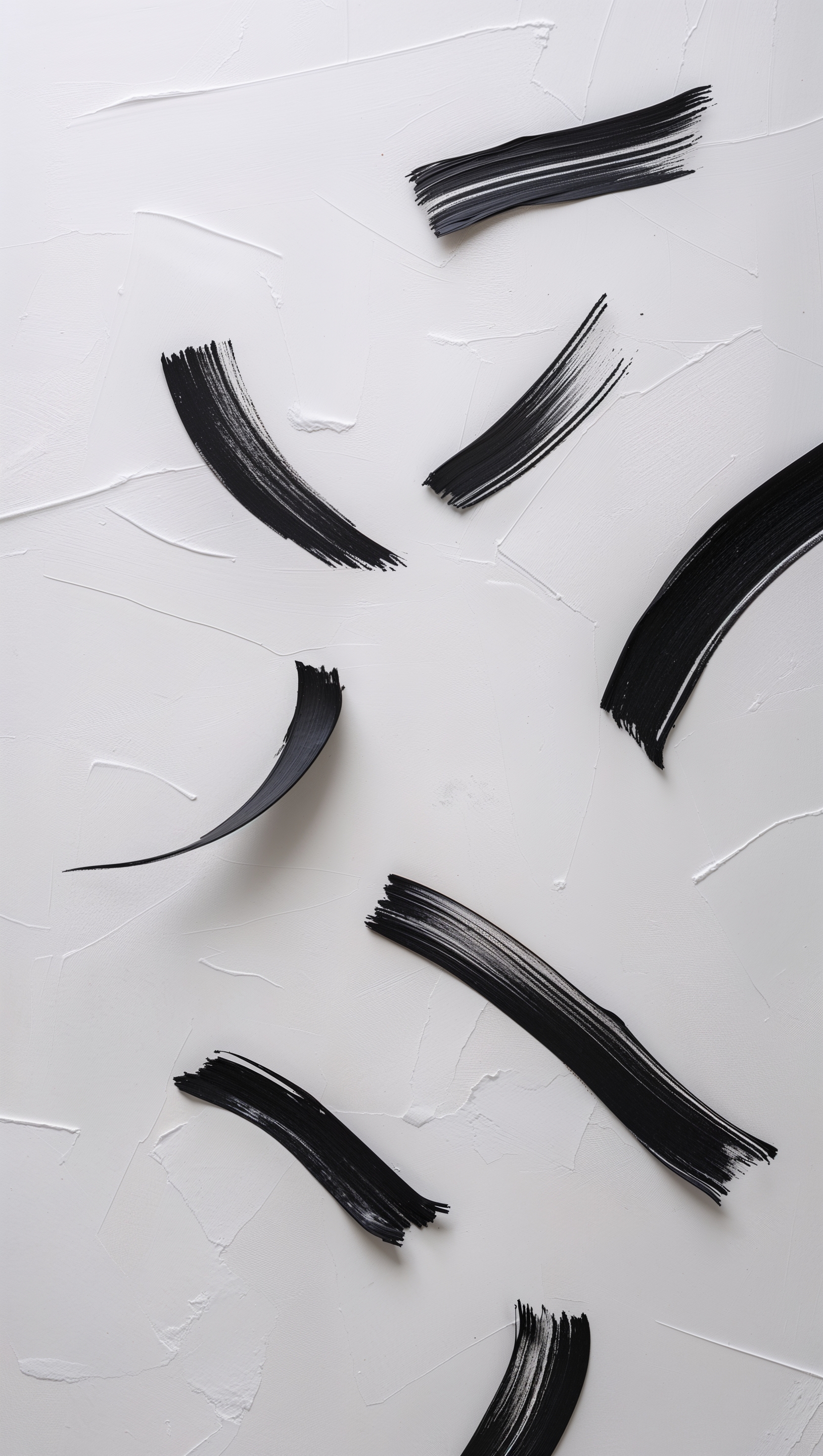 Soft black brush strokes on plain white, abstract and calming composition