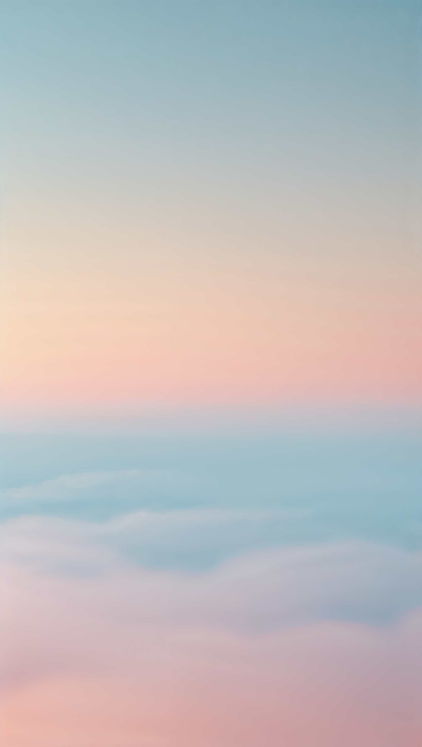 Soft gradient resembling early morning sky with peach and blue hues