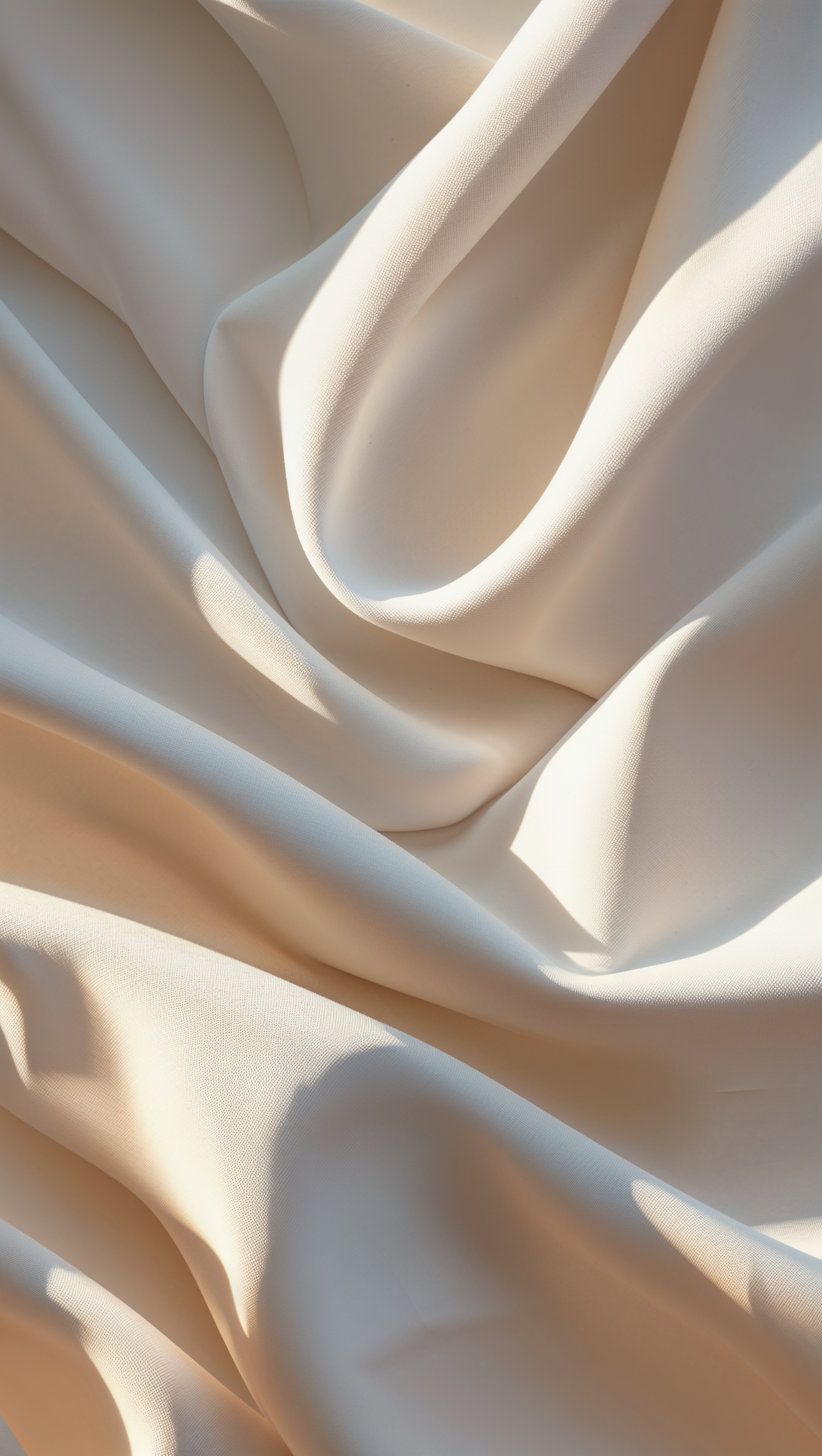 Vertical iPhone wallpaper with folded white fabric and natural lighting