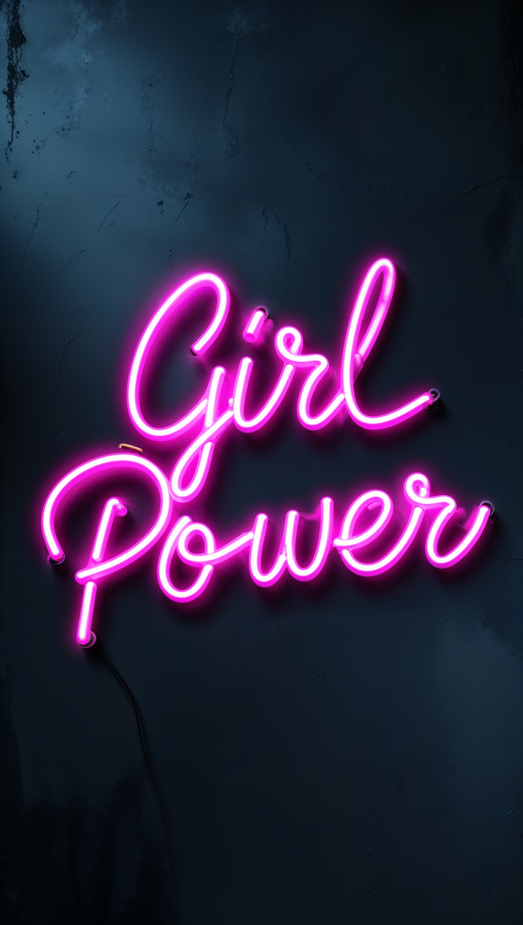 “Girl power” handwritten neon sign with pink glow on dark background