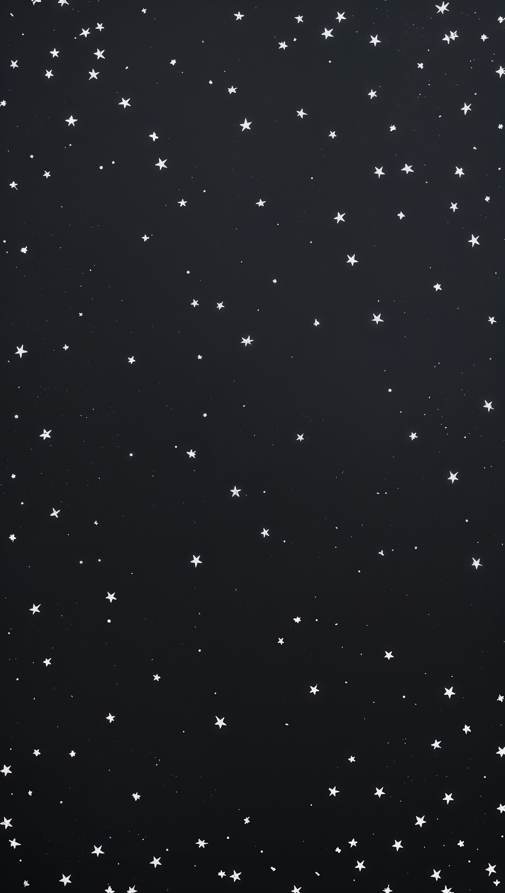 Minimal dark iPhone wallpaper with scattered tiny white stars on solid black
