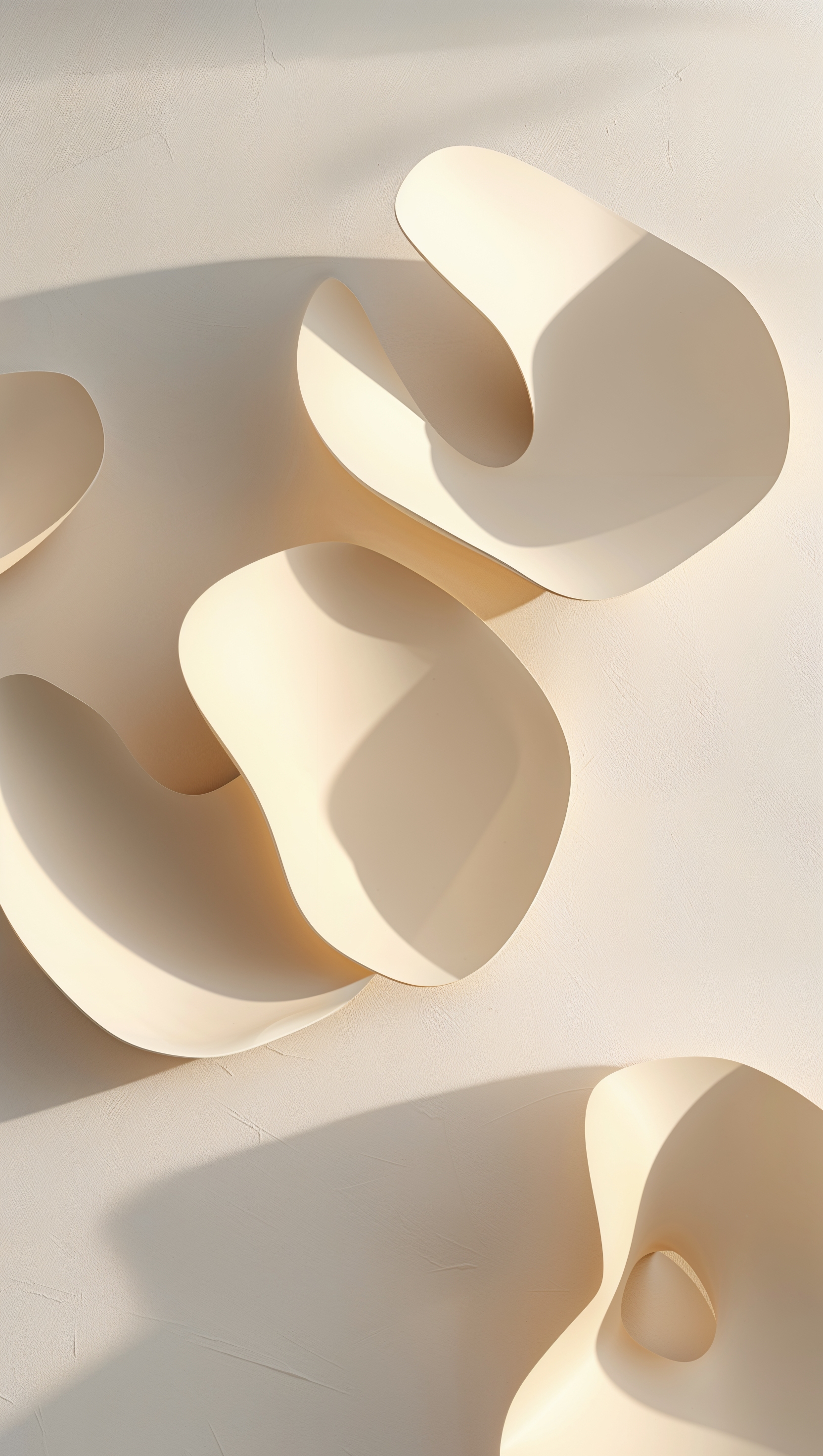 Light beige abstract shapes with gentle shadows on minimal background