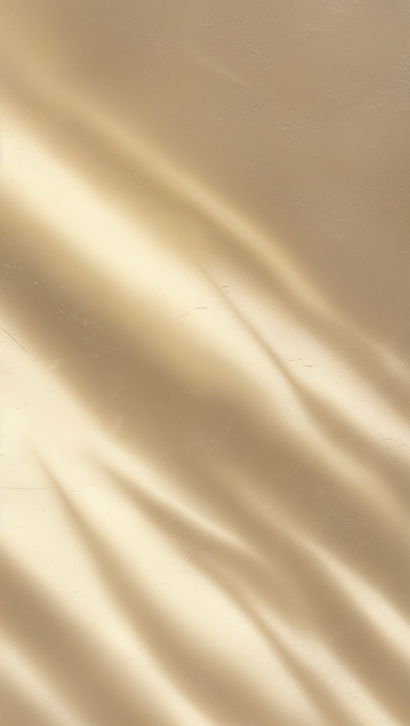 Minimal beige background with subtle texture and light shadows