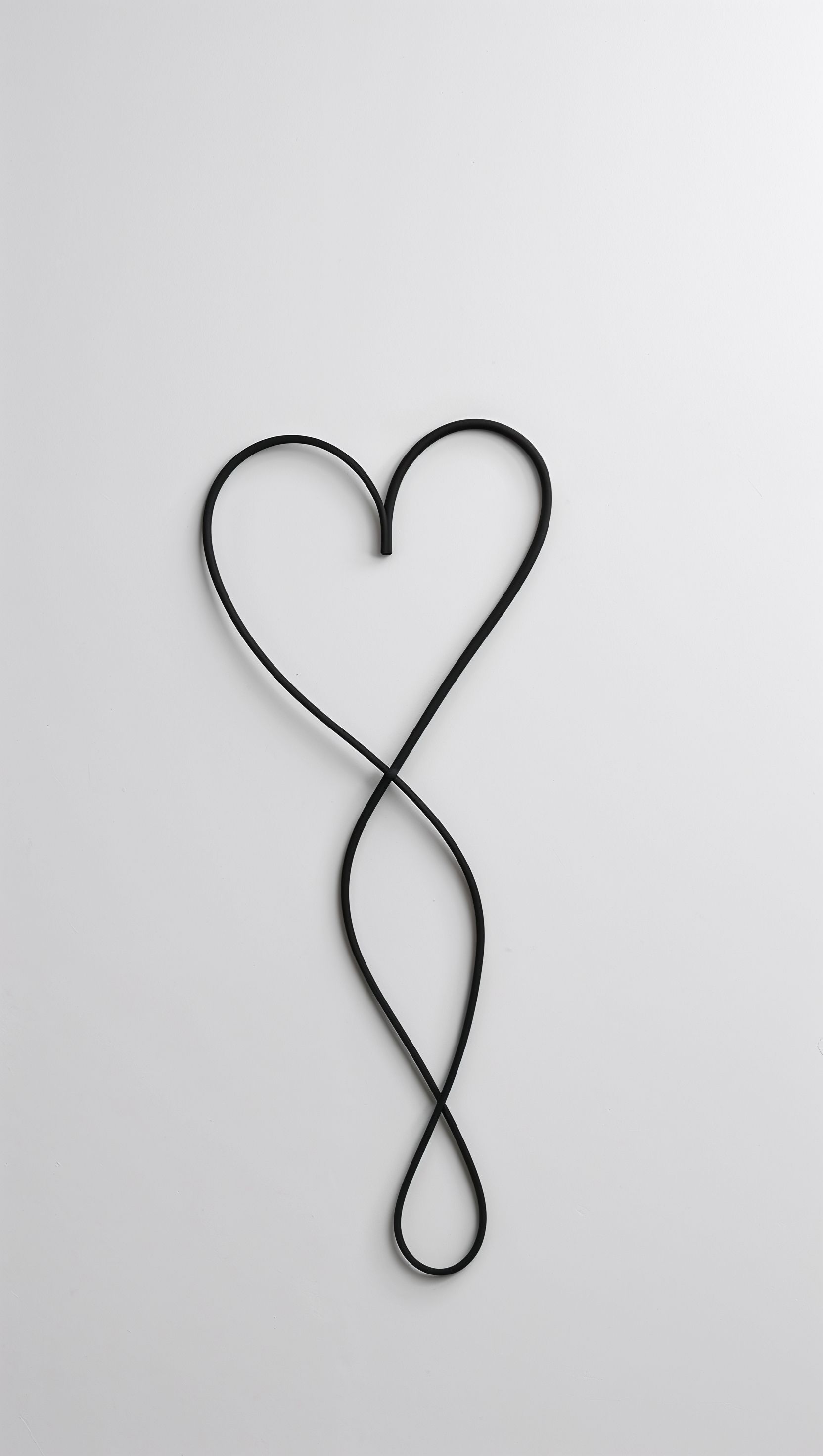 Minimalist white background with one continuous heart line drawing