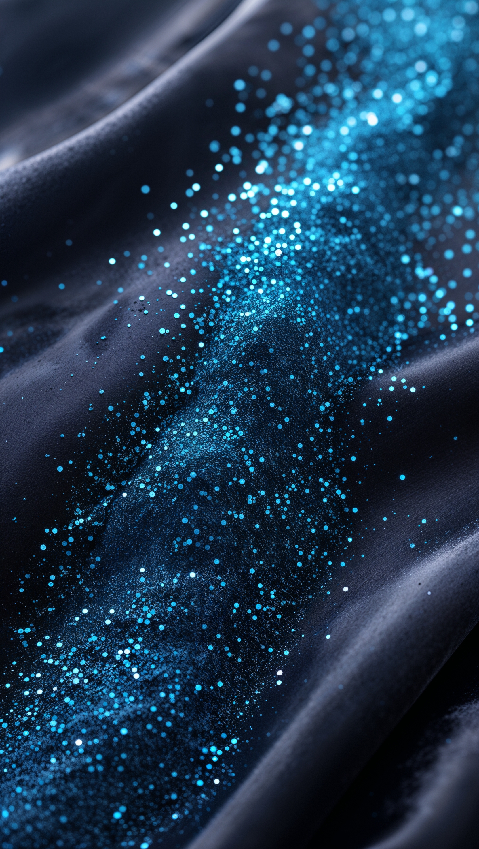 Electric blue glitter dust scattered across a dark gradient backdrop