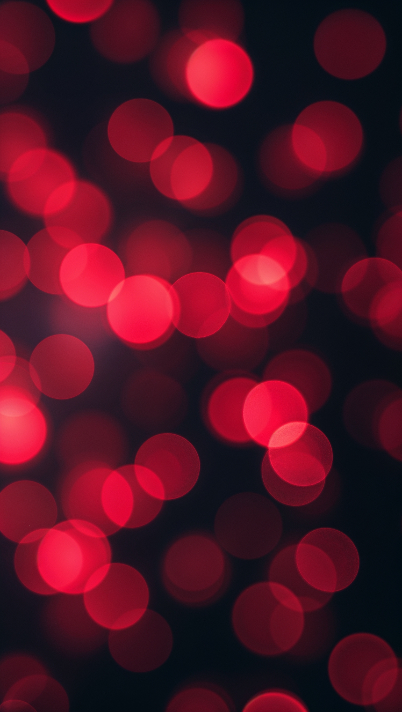 Red bokeh lights softly glowing with dreamy blur effect