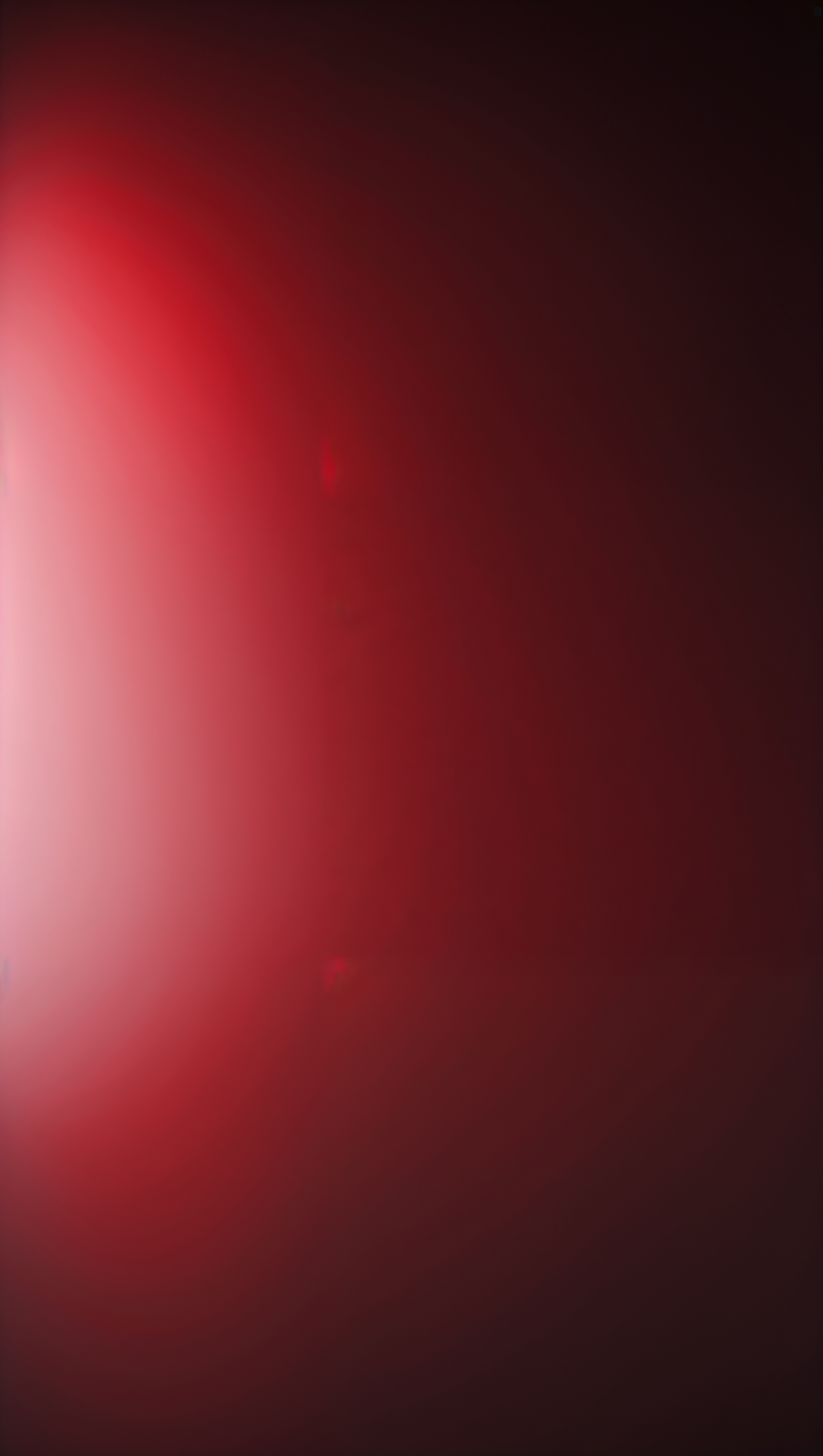 Vertical ombré background fading from scarlet to wine red