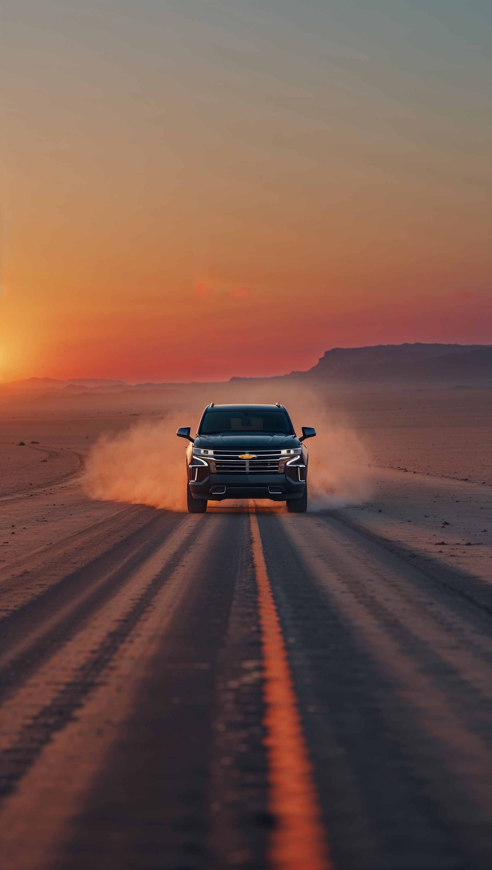 Desert highway with a lone Chevy SUV driving at sunset, cinematic frame, iPhone wallpaper